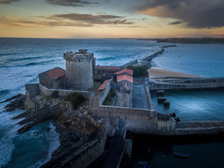Aerial sunset panorama of Socoa fort at the bottom of the Pyrenees on the Atalntic coast with tower and fortification