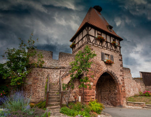 Castle gate with red roof in Alsace France