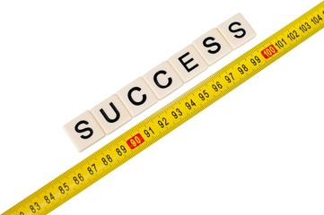 Yellow measuring tape with word success isolated on white