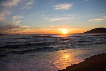 Fototapeta na wymiar Sunset on the beach of cocholgue