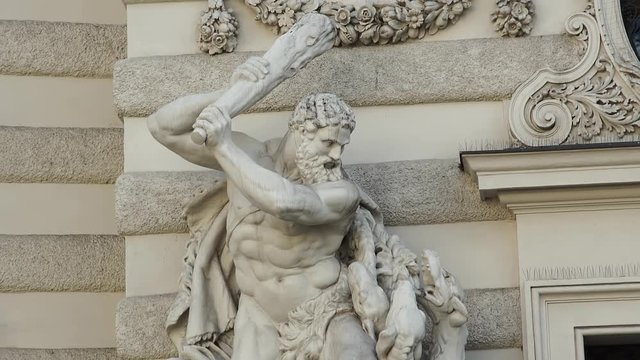 Marble statues in front Hofburg Palace in Vienna, Austria. Slow tilt up.