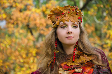 make-up in autumn format, forest fairy in a crown of leaves