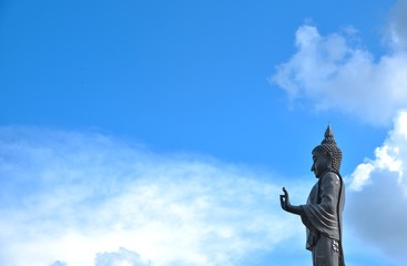 buddha statue on sunshine blue sky