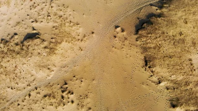 AERIAL: slowly flying verticaly very high over the sand dunes with camera faced down