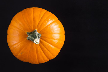 Orange Pumpkin on Black Table