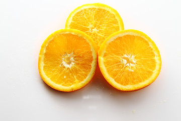 Orange Slice on white background / Orange is a citrus fruit that is quite delicious, juicy with high content Vitamin C. 