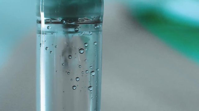 Macro shot of a drop chamber on an intravenous tube in a medical facility