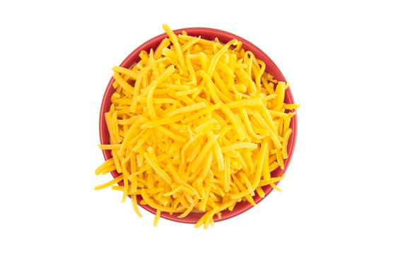 Bowl of Grated Cheddar Cheese on a White Background