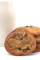 Stack of Chocolate Chip Cookies and a Glass Jar of Milk