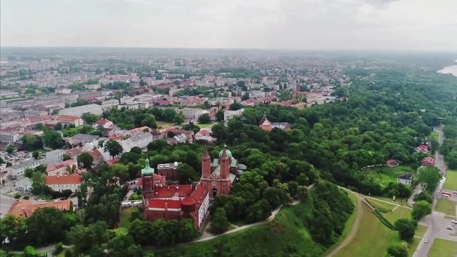 Reverse Areal shoot of Plock town and Cathedral of the Blessed Virgin Mary of Masovia, Poland.