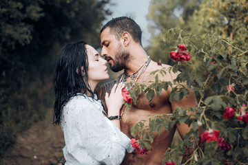 Sensual couple kiss. First love. Hugs together and sensual touch. Intimate relationship and sexual relations. Passionate lover caressing arousing beautiful woman. Woman with muscular latin lover.