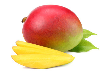 mango with slices and green leaves isolated on white background. healthy food.