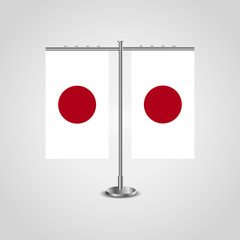 Table stand with flags of Japan and Japan.Two flag. Flag pole. Symbolizing the cooperation between the two countries. Table flags