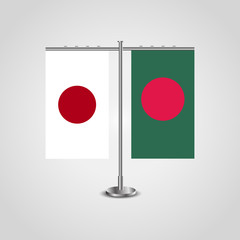 Table stand with flags of Japan and Bangladesh.Two flag. Flag pole. Symbolizing the cooperation between the two countries. Table flags