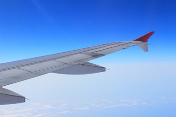 Ailerons and flaps tucked flat in airplane wing at cruise speed