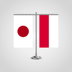 Table stand with flags of Japan and Poland.Two flag. Flag pole. Symbolizing the cooperation between the two countries. Table flags