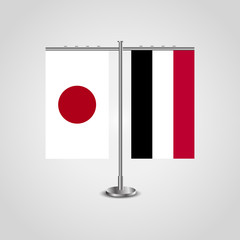 Table stand with flags of Japan and Yemen.Two flag. Flag pole. Symbolizing the cooperation between the two countries. Table flags