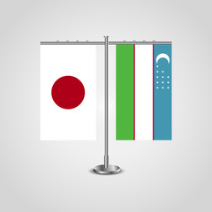 Table stand with flags of Japan and Uzbekistan.Two flag. Flag pole. Symbolizing the cooperation between the two countries. Table flags