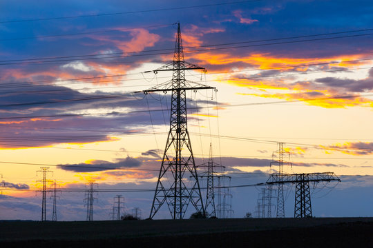 Electricity - Power energy Industry - Electric poles at the sunset with coloful sky