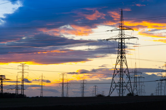 Electricity - Power energy Industry - Electric poles at the sunset with coloful sky