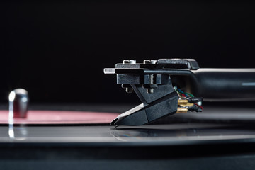 DJ turntable for vinyl records, cartridge on tonearm and space for text.