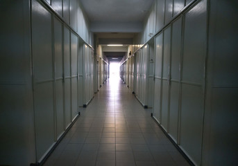 Detail of a white corridor in a hospital. Ray of light at the end of the tunnel.