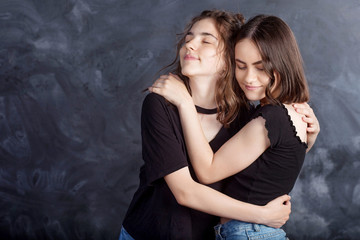 Portrait of two natural  smiling teenage girls. Close up lifestyle portrait of two young girls best friends.