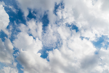 Obraz premium White sparse clouds over blue sky