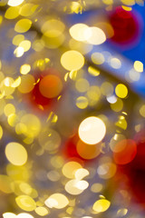 Defocused abstract christmas golden bokeh with red color