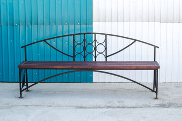 wooden bench with a metal frame