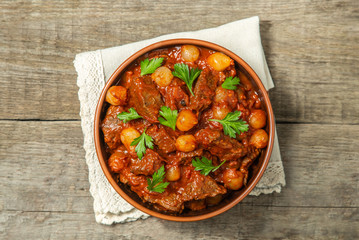 A traditional Greek dish of beef stifado in a sauce. The view from the top. Copy-space