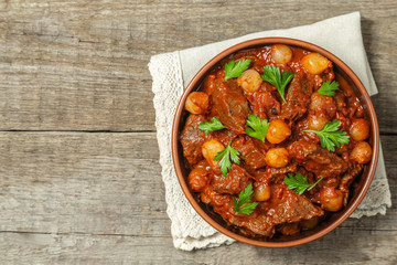 A traditional Greek dish of beef stifado in a sauce. The view from the top. Copy-space