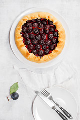 Homemade traditional plum galette on the white plate