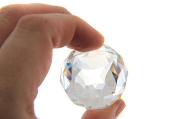 glass sphere in human hand