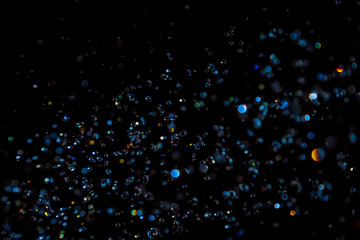 Luxurious Blue bokeh texture on black