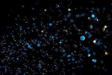 Luxurious Blue bokeh texture on black