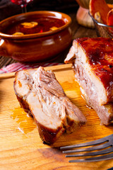 spicy roasted meat with mushroom sauce in the oven