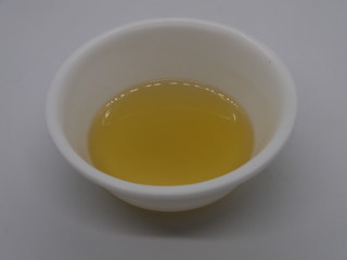 garlic oil,Extreme close-up image of garlic oil studio isolated on Wooden background, making Garlic Oil for Pain, Oil For Arthrites Joint Pain
