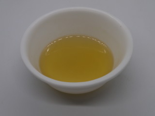 garlic oil,Extreme close-up image of garlic oil studio isolated on Wooden background, making Garlic Oil for Pain, Oil For Arthrites Joint Pain
