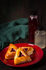 pies with cherries and drinks in a bottle
