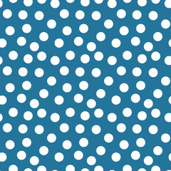 Dot pattern. Seamless blue background with white randomly circles.