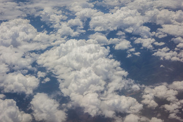 Fototapeta na wymiar Blue sky with clouds background on the airplan