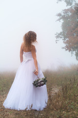 Fototapeta na wymiar Bride with a bouquet
