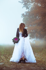 Fototapeta premium Bride in a black leather jacket