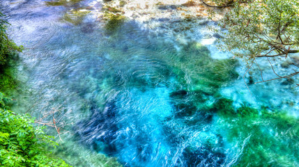 Fototapeta na wymiar View to Blue Eye spring, initial water source of Bistrice river,near Muzine in Vlore County, southern Albania.