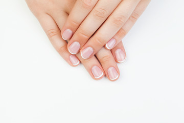 Beautiful female hands. Manicured hands on white background