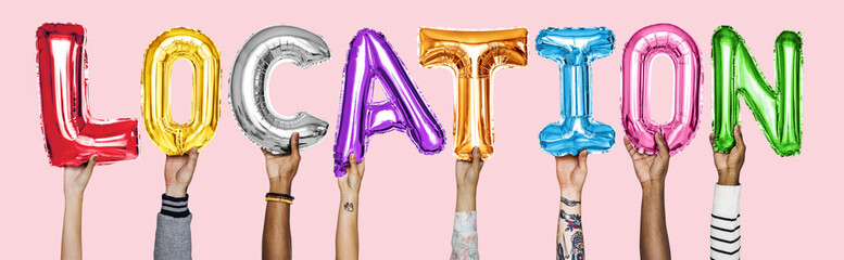 Hands showing location balloons word