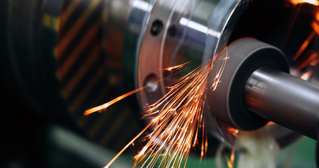 Finishing metal working on high precision grinding machine in workshop - obrazy, fototapety, plakaty