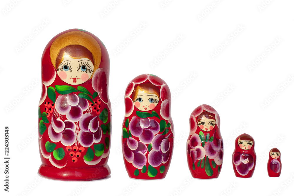 Wall mural Matryoshka Russian doll souvenir in group bright red on white background isolated closeup