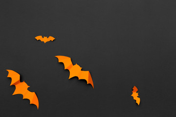 halloween and decoration concept - paper bats flying